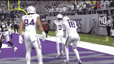 A Football Player With The Number 3 On His Jersey Stands On The Field GIF