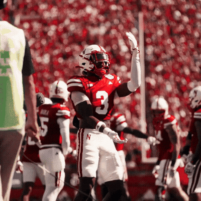 A Football Player With The Number 3 On His Jersey Stands On The Field GIF