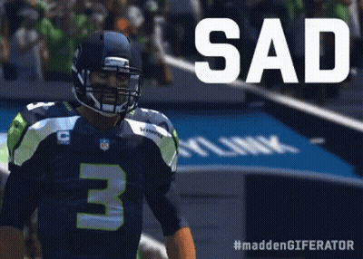 A Football Player With The Number 3 On His Jersey Stands On The Field GIF