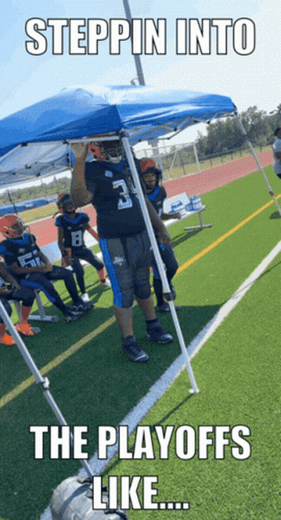 A Football Player With The Number 3 On His Jersey Stands Under A Blue Tent GIF