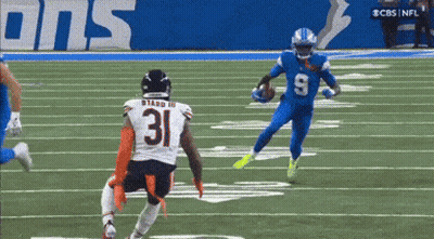A Football Player With The Number 31 On His Jersey Runs With The Ball GIF