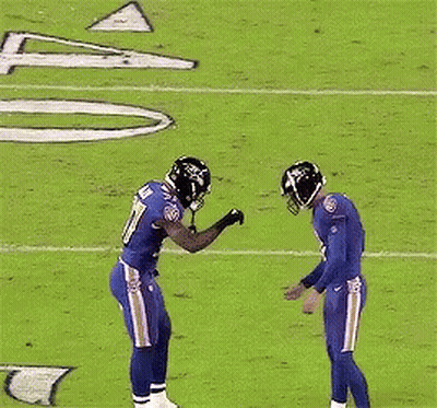 A Football Player With The Number 37 On His Jersey Stands On The Field GIF