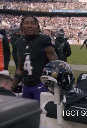 A Football Player With The Number 4 On His Jersey Is Standing On The Field GIF