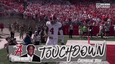 A Football Player With The Number 4 On His Jersey Stands On The Field GIF