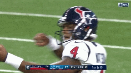 A Football Player With The Number 4 On His Jersey Stands On The Field GIF
