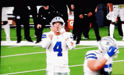 A Football Player With The Number 4 On His Jersey Stands On The Field GIF