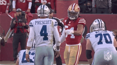 A Football Player With The Number 4 On His Jersey Talks To Another Player GIF
