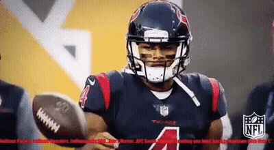 A Football Player With The Number 4 On His Jersey Throws The Ball GIF