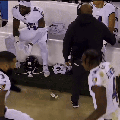 A Football Player With The Number 5 On His Jersey Is Sitting On A Bench GIF