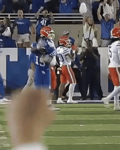 A Football Player With The Number 5 On His Jersey Runs On The Field GIF
