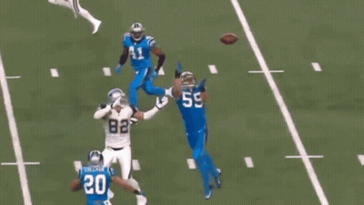 A Football Player With The Number 5 On His Jersey Runs With The Ball GIF