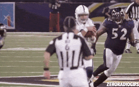 A Football Player With The Number 52 On His Jersey Is Running Towards A Referee GIF