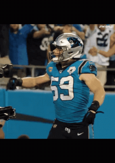 A Football Player With The Number 53 On His Jersey Stands On The Field GIF
