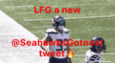 A Football Player With The Number 53 On His Jersey Stands On The Field GIF