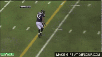A Football Player With The Number 56 On His Back Is Laying On The Field GIF