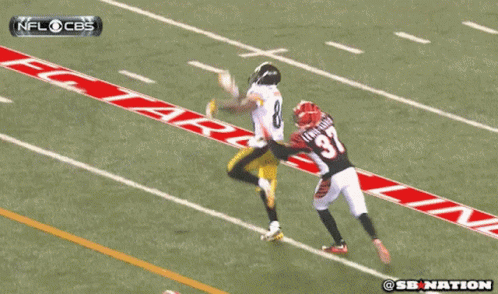 A Football Player With The Number 57 On His Back Is Being Tackled By Another Player GIF