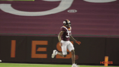 A Football Player With The Number 57 On His Jersey Is Running On The Field GIF