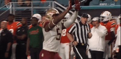A Football Player With The Number 58 On His Jersey Is Running Towards A Referee GIF