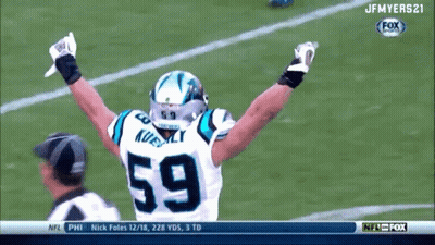 A Football Player With The Number 59 On His Jersey Celebrates GIF