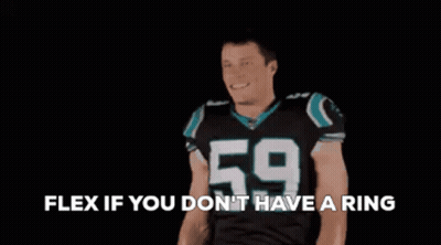 A Football Player With The Number 59 On His Jersey Is Flexing His Arms GIF