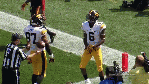 A Football Player With The Number 6 On His Jersey Stands On The Field GIF