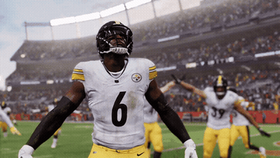 A Football Player With The Number 6 On His Jersey Stands On The Field GIF