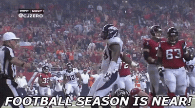A Football Player With The Number 63 On His Jersey Is Running On A Field GIF