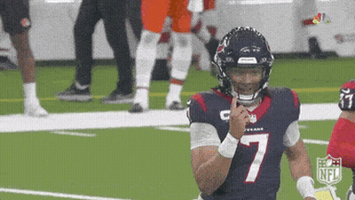 A Football Player With The Number 7 On His Jersey Holds His Finger To His Mouth . GIF