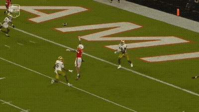 A Football Player With The Number 7 On His Jersey Is Being Tackled By Another Player GIF