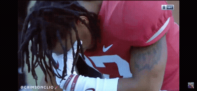 A Football Player With The Number 7 On His Jersey Is Kneeling Down GIF