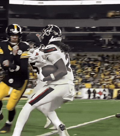 A Football Player With The Number 7 On His Jersey Is Running With The Ball GIF