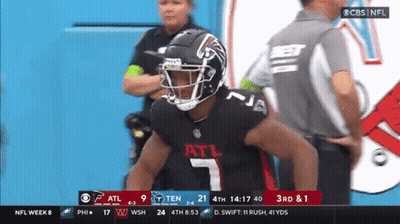 A Football Player With The Number 7 On His Jersey Stands In Front Of A Referee GIF