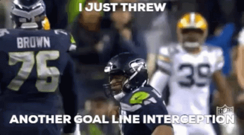 A Football Player With The Number 75 On His Jersey Is Throwing Another Goal Line Interception . GIF