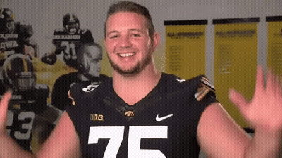 A Football Player With The Number 75 On His Shirt GIF