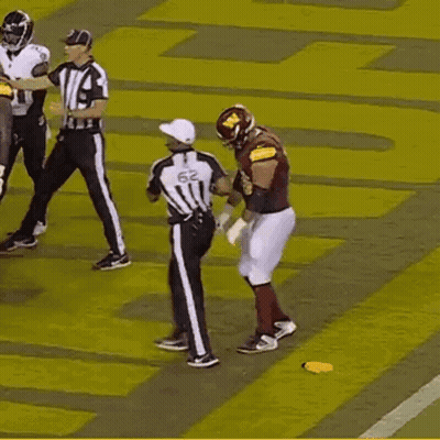 A Football Player With The Number 78 On His Jersey Stands On The Field GIF