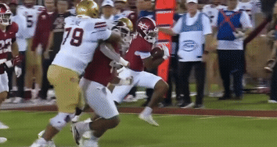 A Football Player With The Number 79 On Their Jersey GIF