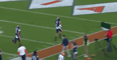 A Football Player With The Number 8 On His Jersey Catches The Ball GIF