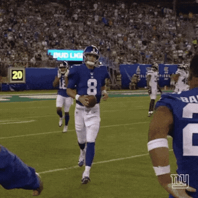 A Football Player With The Number 8 On His Jersey Is Holding A Ball On A Field . GIF