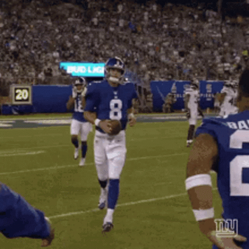 A Football Player With The Number 8 On His Jersey Runs With The Ball GIF