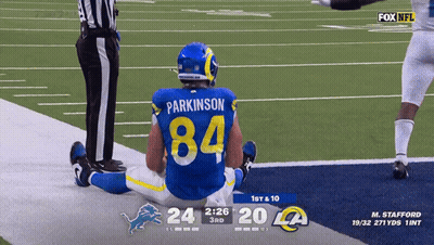 A Football Player With The Number 84 On His Back GIF
