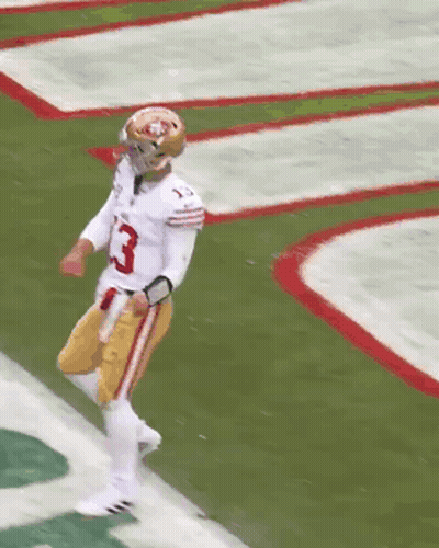 A Football Player With The Number 85 On His Jersey Stands On The Field GIF