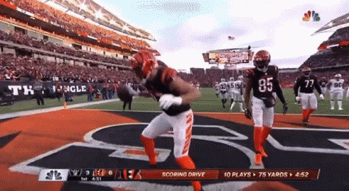 A Football Player With The Number 85 On The Back Of His Jersey Is Running On The Field GIF