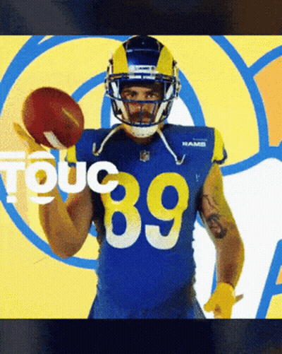 A Football Player With The Number 89 On His Jersey Holds A Football GIF