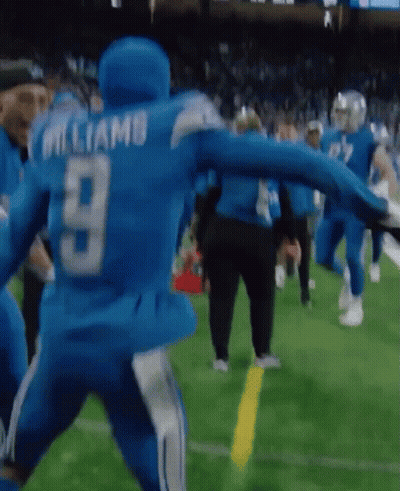 A Football Player With The Number 9 On His Back Is Running On The Field GIF