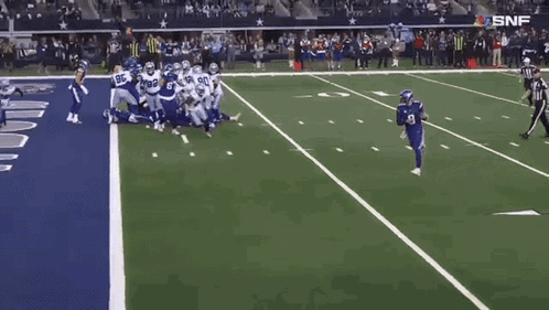 A Football Player With The Number 9 On His Jersey Runs On The Field GIF