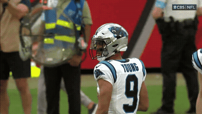 A Football Player With The Number 9 On His Jersey Stands On The Field GIF