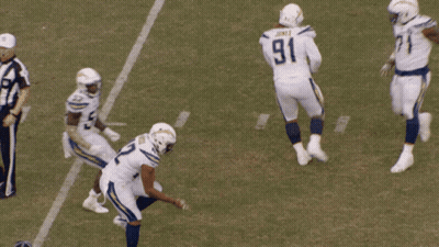 A Football Player With The Number 91 On His Jersey Is Getting Ready To Kick The Ball GIF