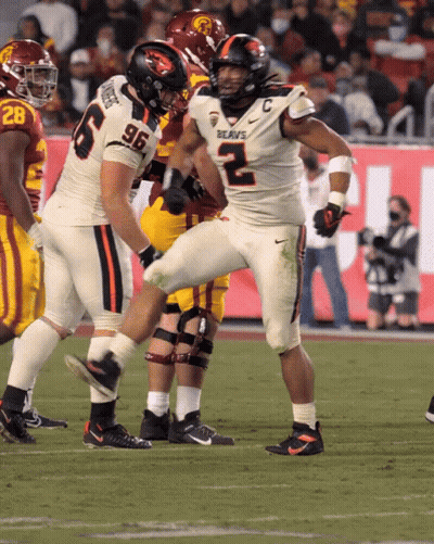 A Football Player With The Number 96 On His Jersey Is Kicking A Ball GIF
