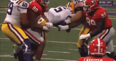 A Football Player With The Number 99 On His Shirt GIF