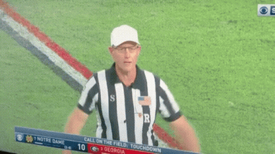 A Football Referee With The Letter R On His Back GIF